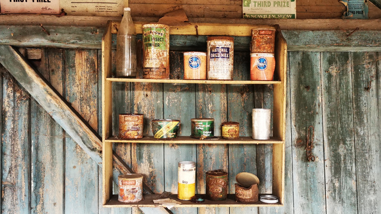 Rusty cans on a shelf in a fallout shelter