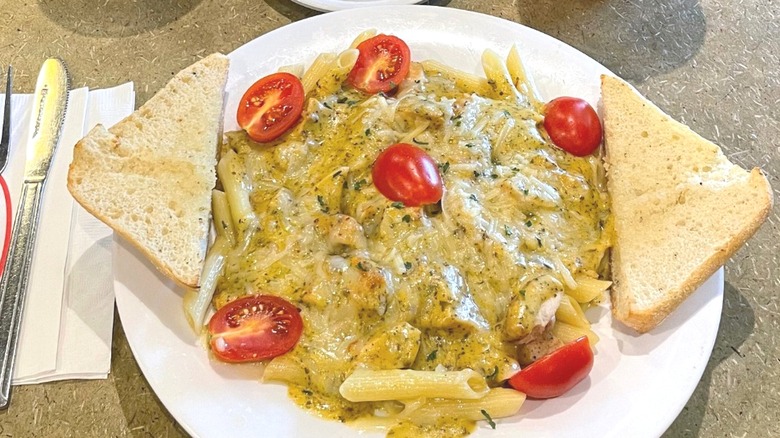 Pesto penne pasta in restaurant