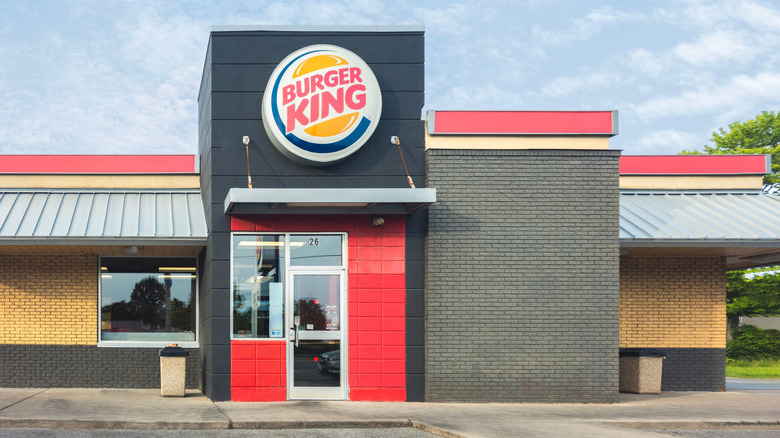 The outside of a Burger King store front.