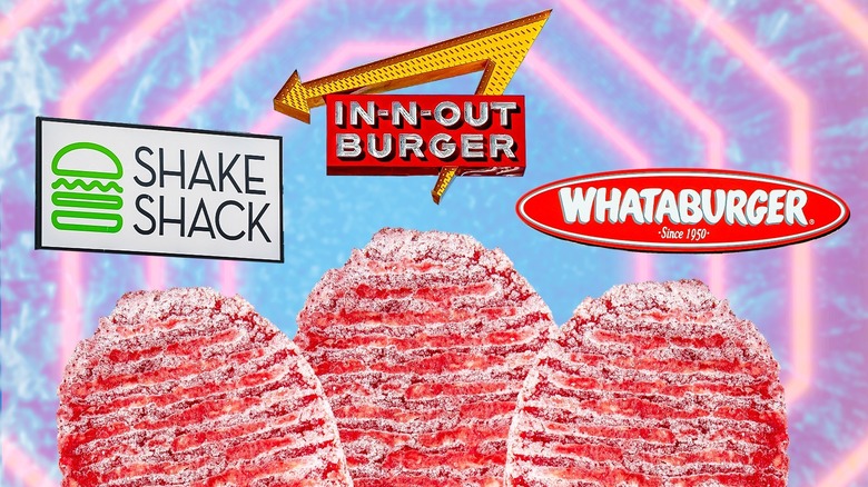 Fresh hamburger patties in front of signs for Shake Shack, In-N-Out Burger, and Whataburger