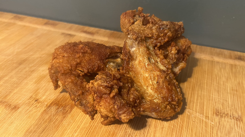 A single chicken wing from Pollo Campero