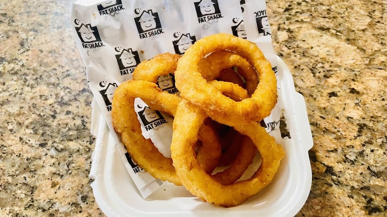 Order of Fat Shack Onion Rings on marble counter