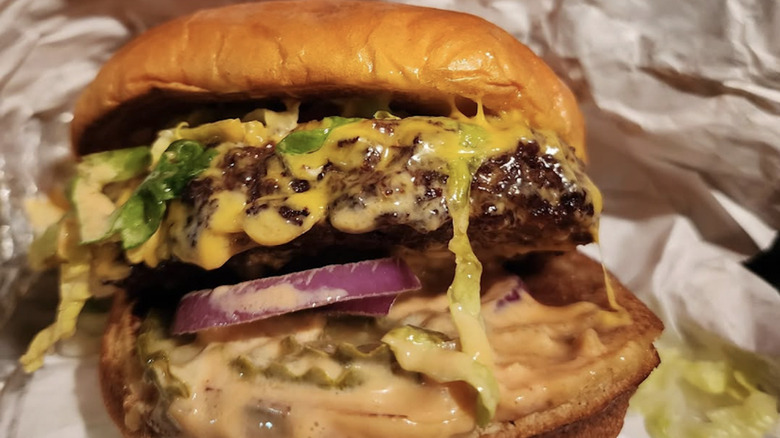 Wagyu Burger from Arby's with lettuce, onions, and cheese