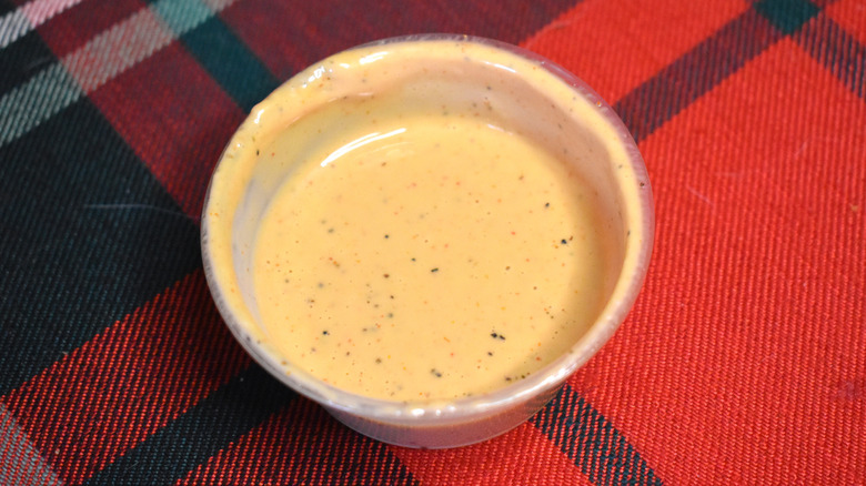 small container of dipping sauce