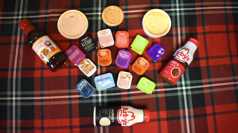 collection of fast food sauces on a table