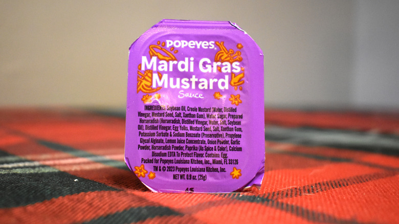 orange and purple container of mardis gras mustard