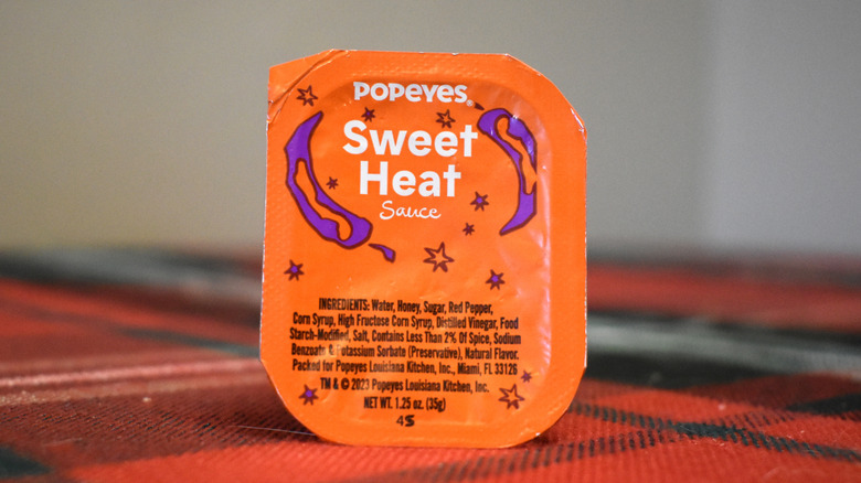 orange container of sweet heat sauce