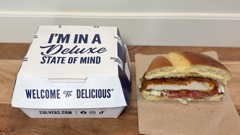 Culver's Spicy Crispy Chicken Sandwich half on napkin next to box