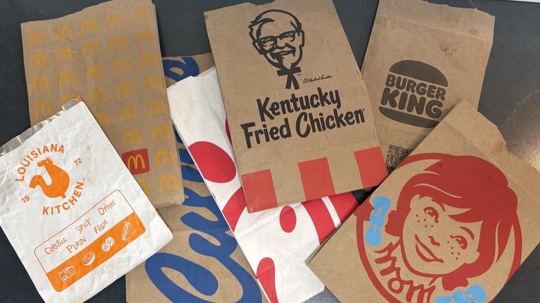 Flat bags from Spicy Chicken Sandwiches on black countertop