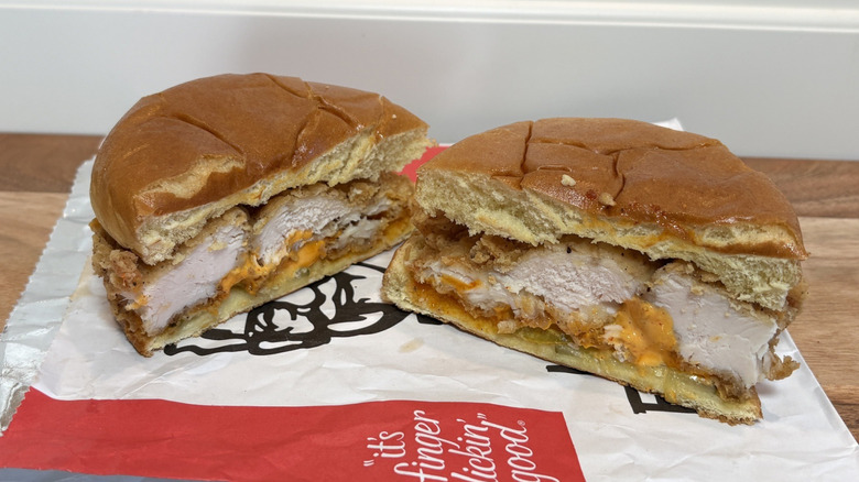 KFC Spicy Chicken Sandwich cut in half on wrapper