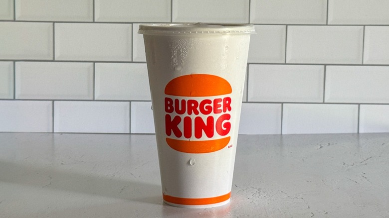 A medium Burger King cup filled with sweet tea