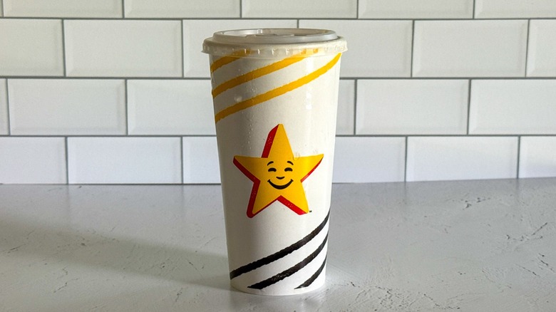 A 20-ounce Hardee's cup filled with sweet tea