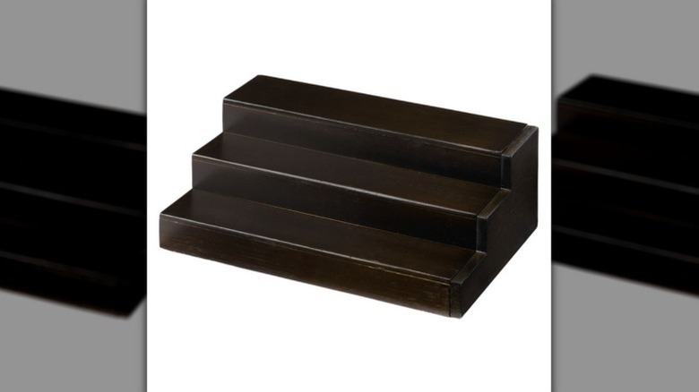 Dark brown three-tiered shelf.