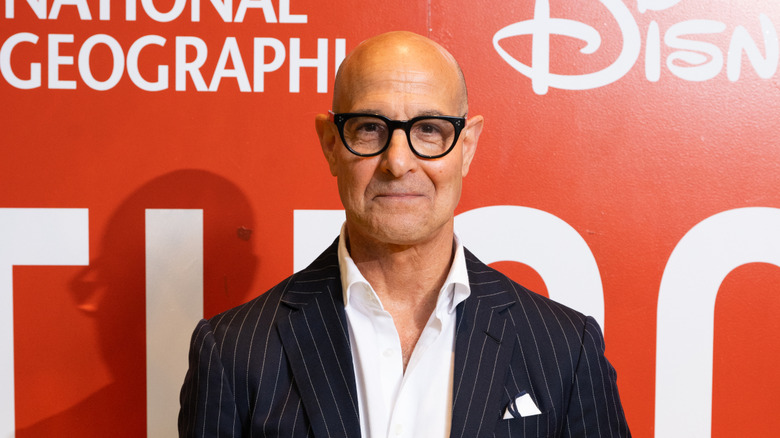 Stanley Tucci posing at an event