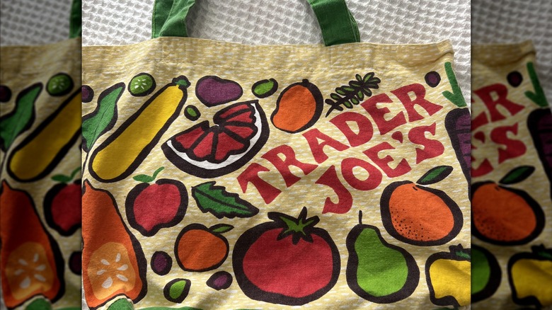 A Trader Joe's bag with veggies all over it