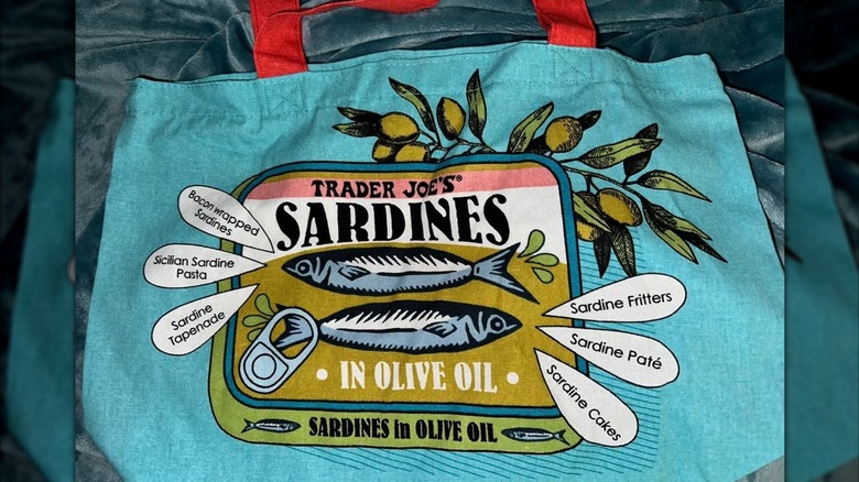 A Trader Joe's tote bag with a can of talking sardines on it