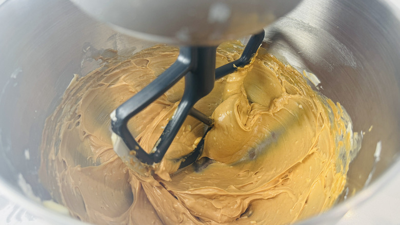 Beating butter and peanut butter in mixer