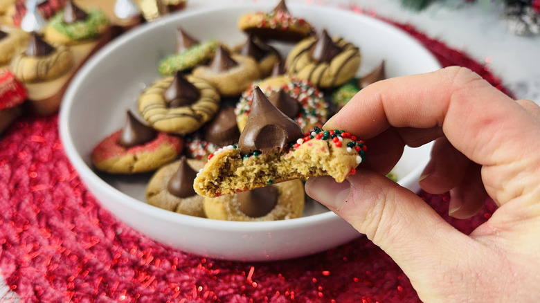Holding peanut butter blossom cookie