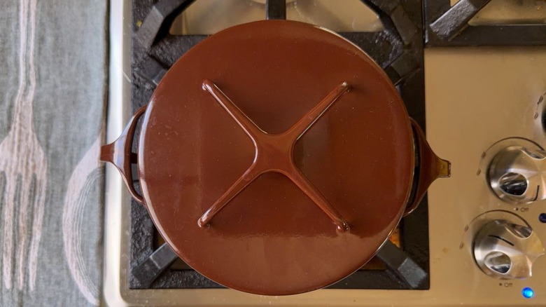 Covered brown pot on stovetop