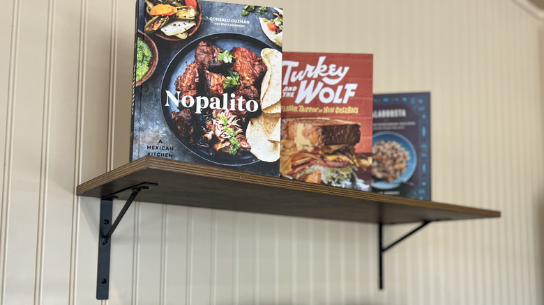 collection of cookbooks displayed on shelf