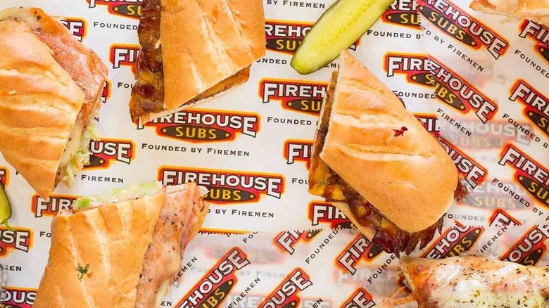 Overhead view of various Firehouse Subs on company branded takeout paper