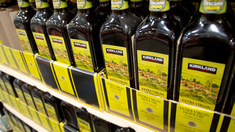 Bottles of Kirkland Signature Extra-Virgin Olive Oil at a Costco warehouse