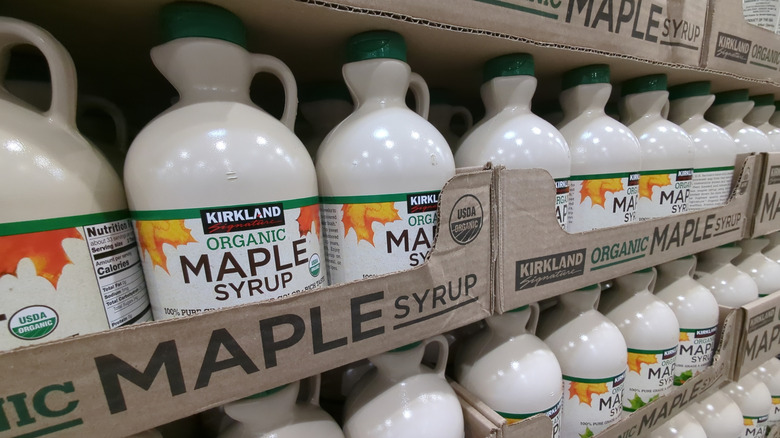 Bottles of Kirkland Signature Organic Maple Syrup at a Costco warehouse