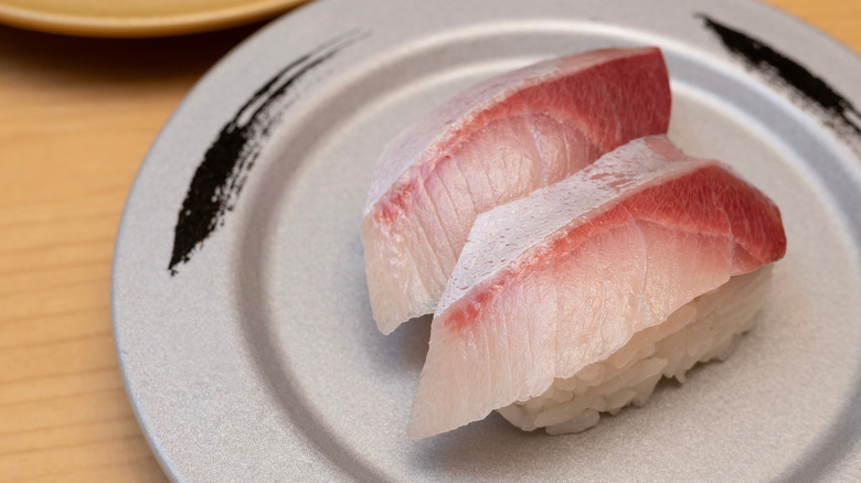 Yellowtail sashimi on white plate