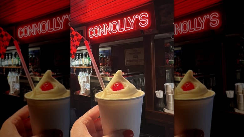 Connolly's frozen drink is served in a white cup with a cherry on top.
