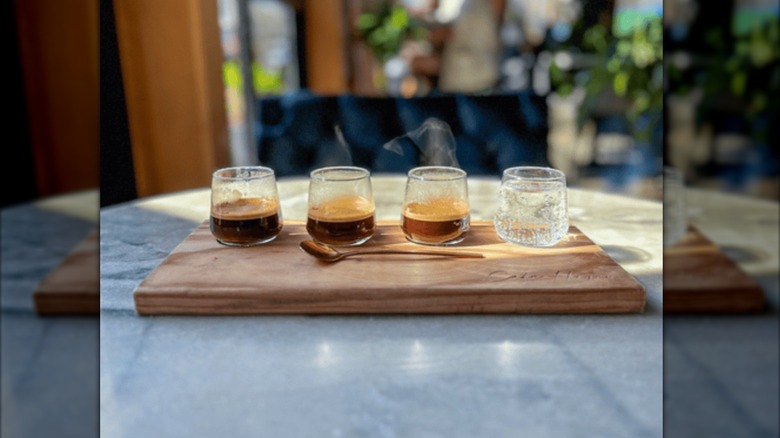 Shots of hot espresso lined up on a tasting tray at Cafe Hagen in Seattle.