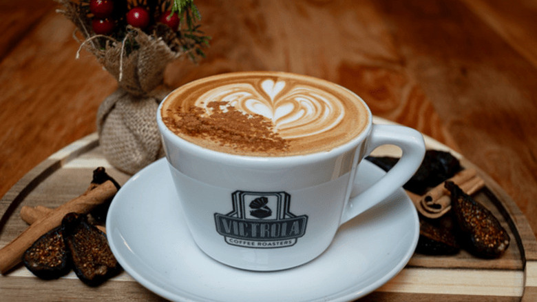 A latte in a mug from Victrola Coffee in Seattle, Washington.
