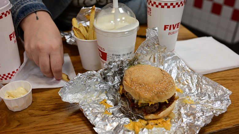 The Five Guys Perk That (Almost) Redeems Its Overpriced Burgers