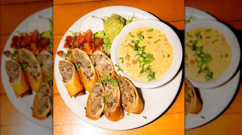 The mini chimichangas plate with some garnishes and dip at The Alpine Diner in Seattle.