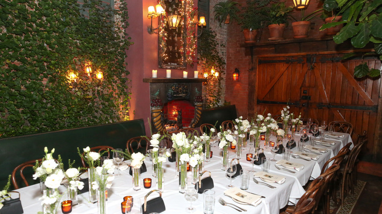 The garden at the Waverly Inn features crawling ivy across brick walls.