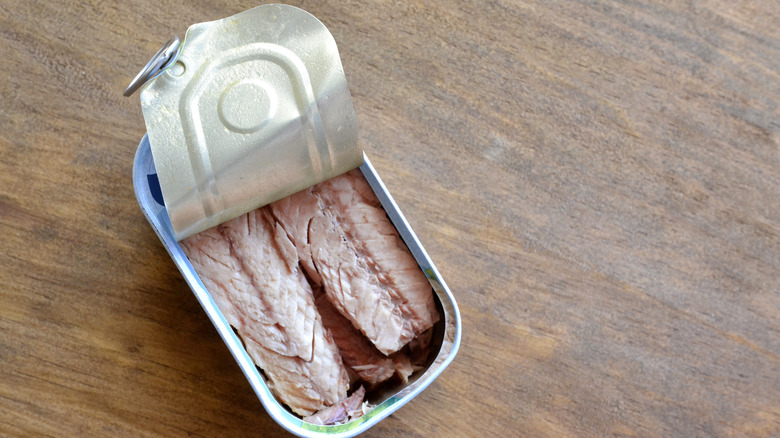 opened tin fish container