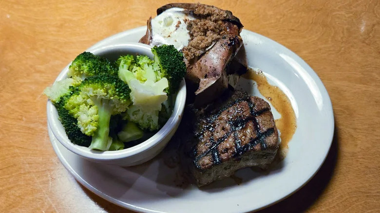A sirloin steak with sweet potato and steamed broccoli from Texas Roadhouse