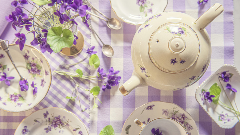 antique teapots and plates with violet pattern