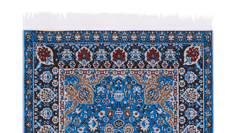 rug with floral pattern on white background