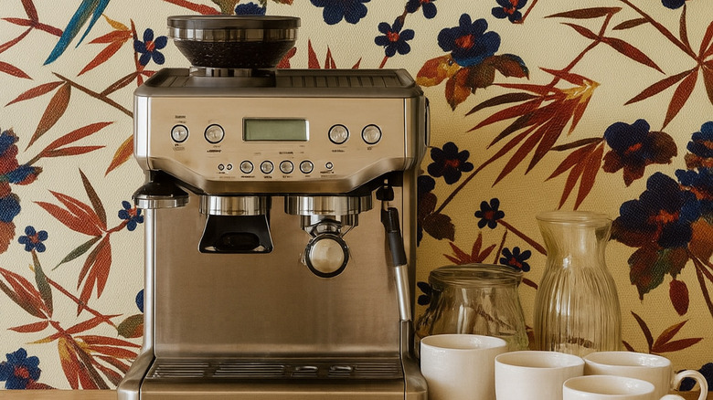 coffee machine against floral wallpaper