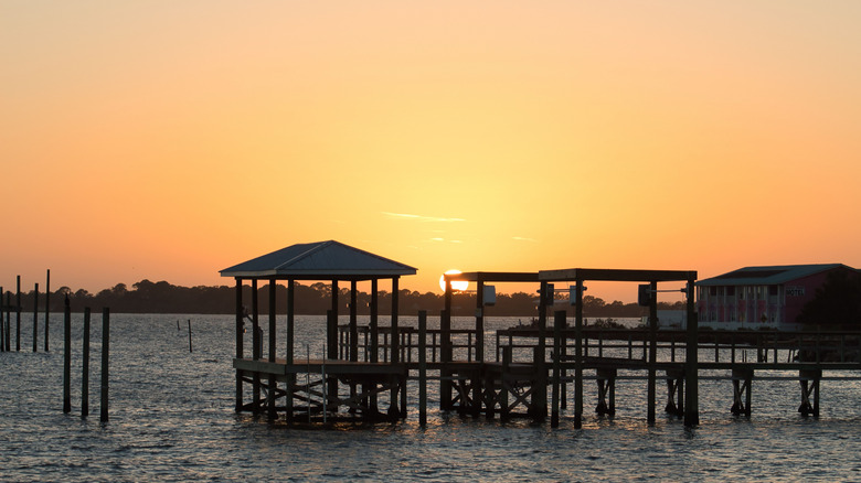Sunset over water with docks in Cedar Key, FL