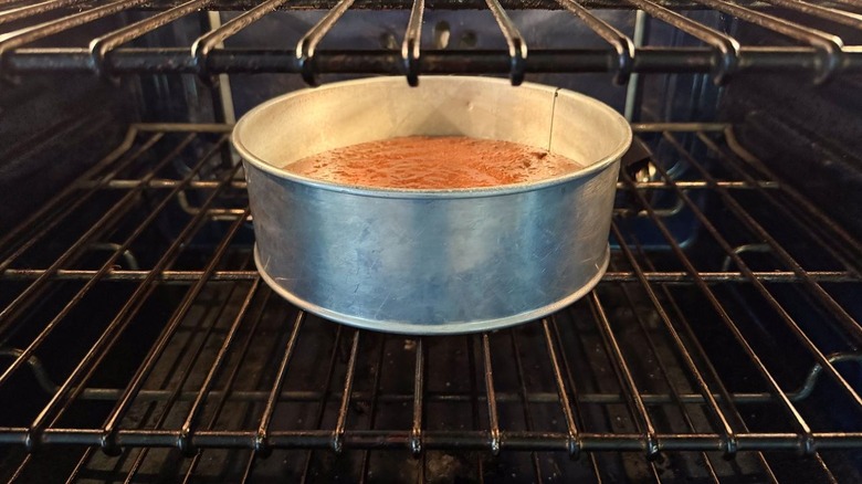 Gianduja chocolate cake batter in springform pan in oven