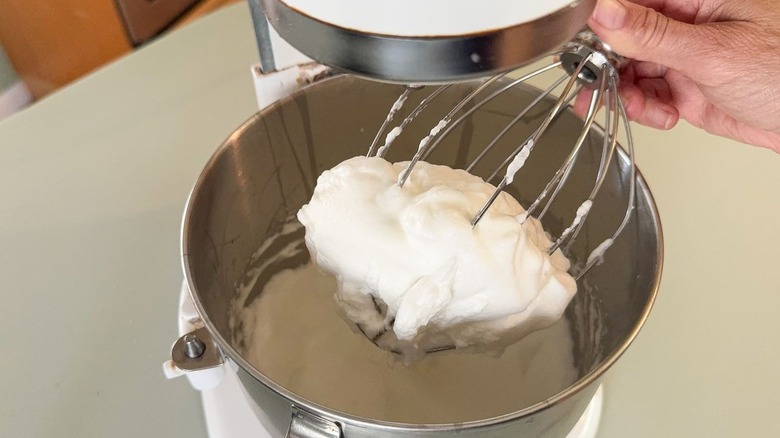 Egg whites beaten to stiff peaks in stand mixer with whisk attachment
