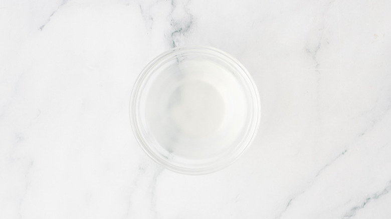 Small bowl filled with pasta water