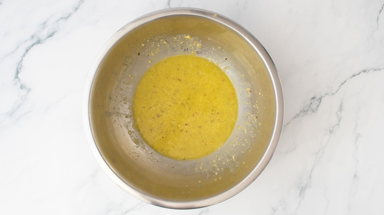 Olive oil and corn-based sauce in a large bowl