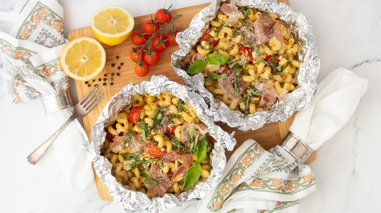 Overhead shot of two foil pouches filled with pasta