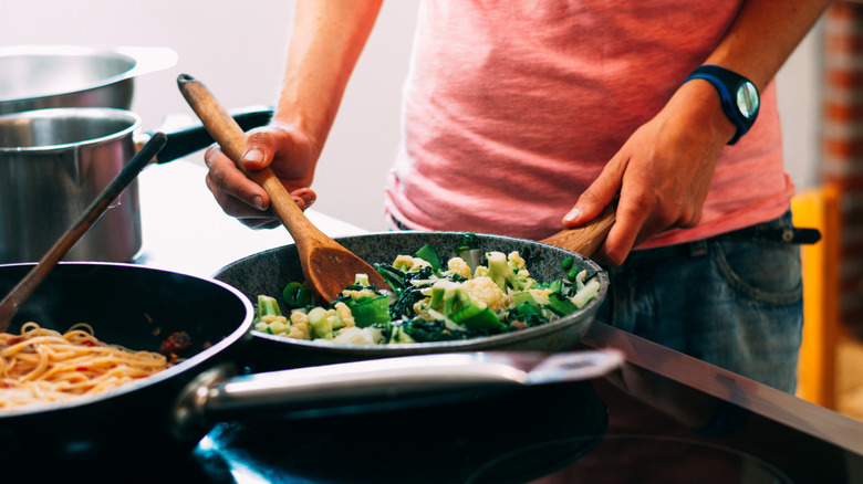 Sautéing vegetables over the stove