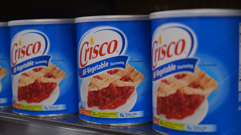 Cans of Crisco on a shelf