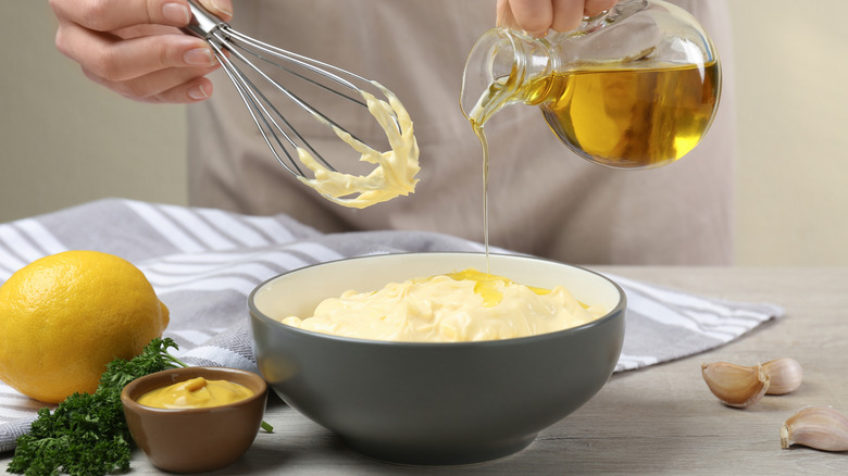 Person making homemade mayonnaise