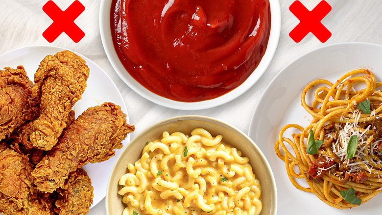 fried chicken, mac and cheese, pasta, and ketchup with red Xs