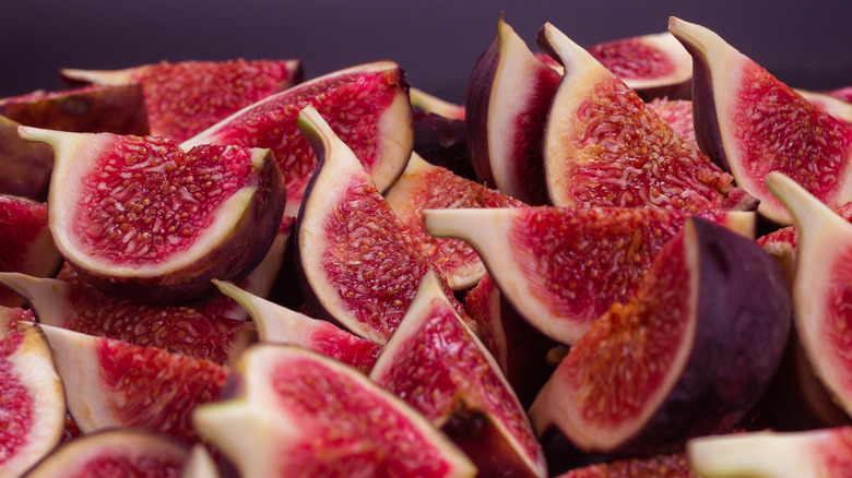 Sliced figs on a purple background
